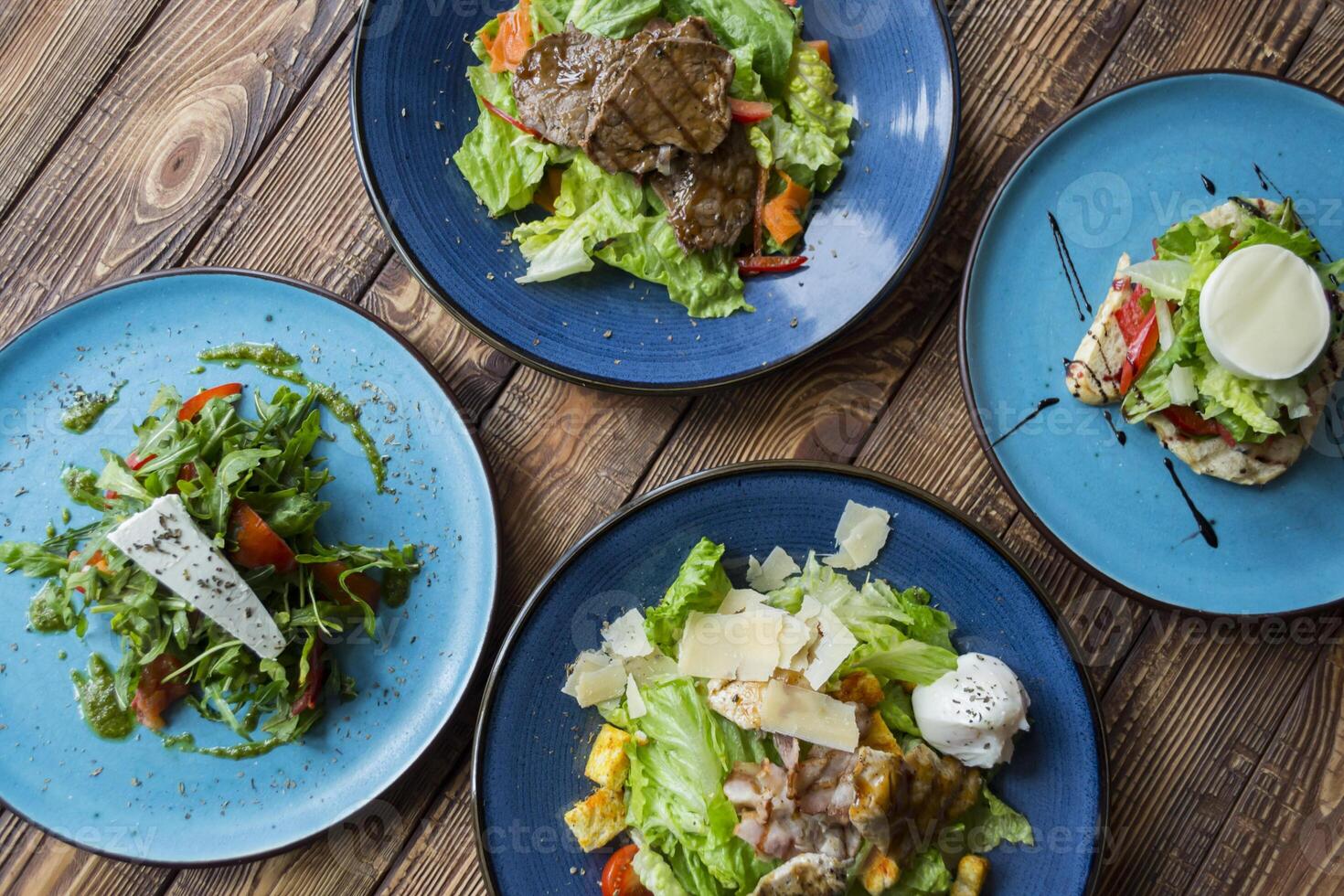 The tasty salads on a table. photo