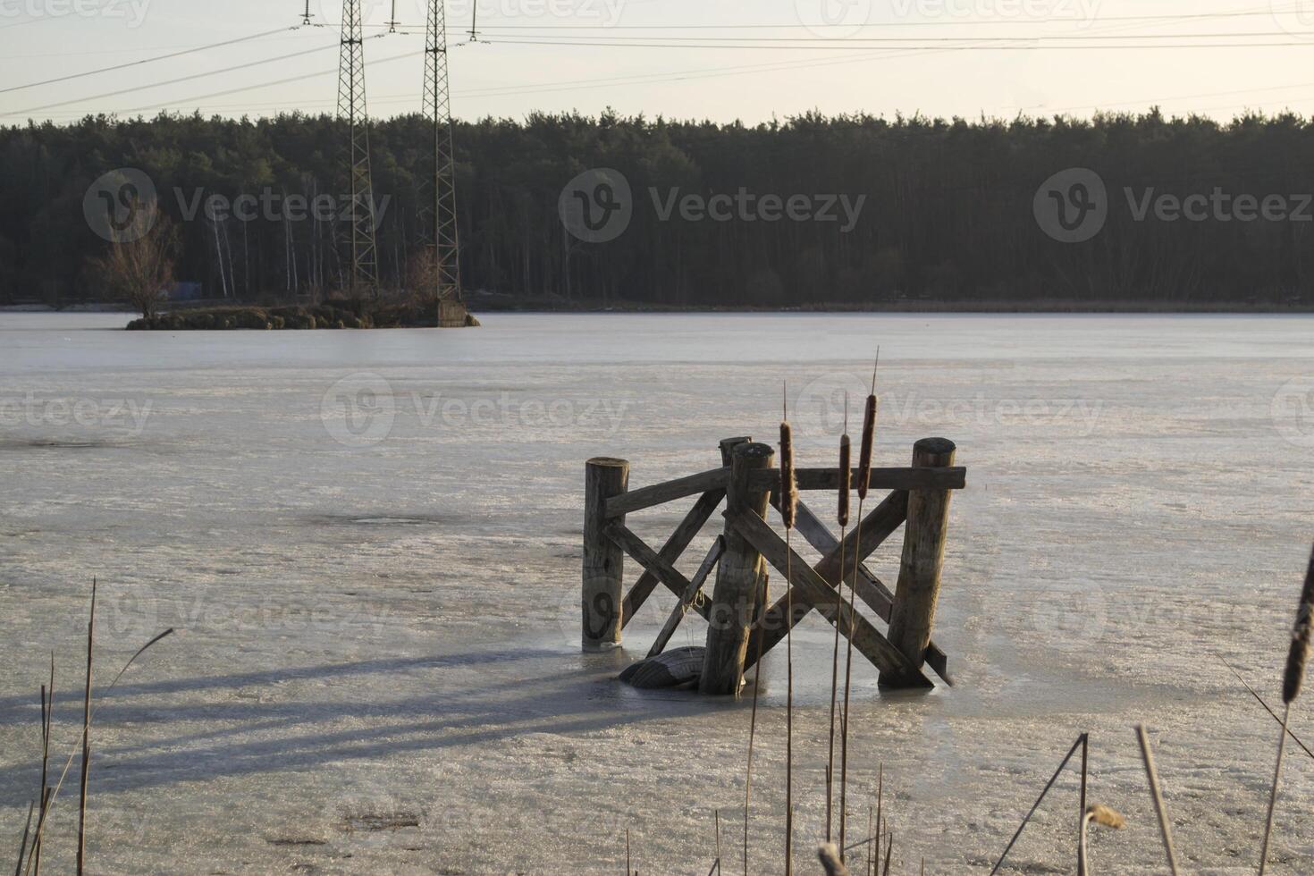 Old wooden pier on the lake. photo