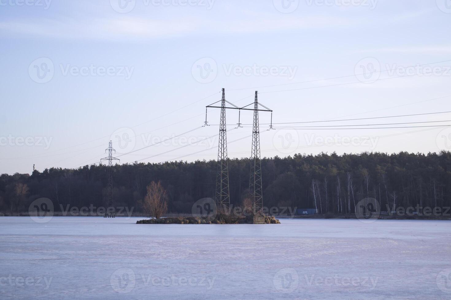 Electric towers on a island on the lake. photo