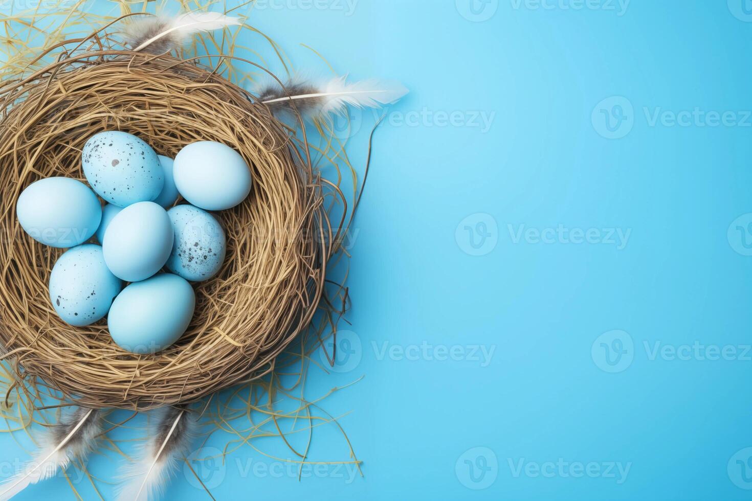 Easter holiday celebration banner greeting card with pastel painted eggs in bird nest on bright blue backround tabel texture. Top view, flat lay with copy space photo