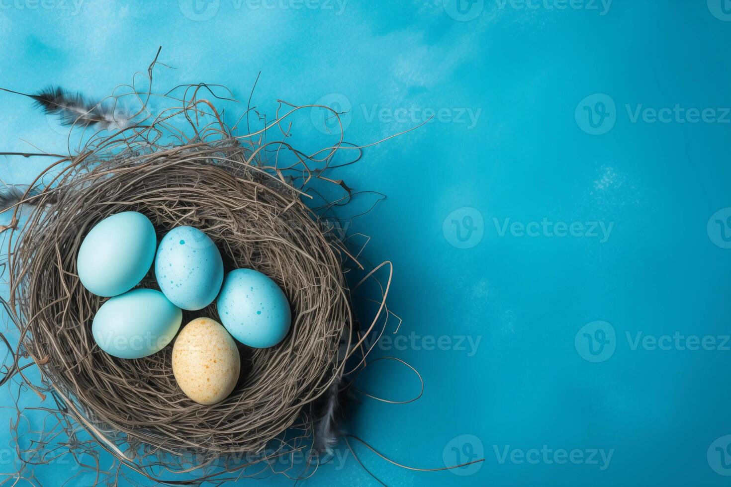 Easter holiday celebration banner greeting card with pastel painted eggs in bird nest on bright blue backround tabel texture. Top view, flat lay with copy space photo