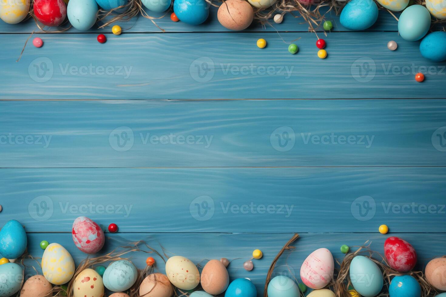 Easter holiday celebration banner greeting card banner - frame made of painted easter eggs on blue wooden table texture, top view, flat lay photo