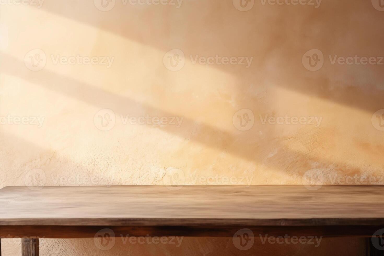 Empty wooden table top near stucco wall with with sunlight falling from the window and shadows. Table top with copy space for product advertising photo