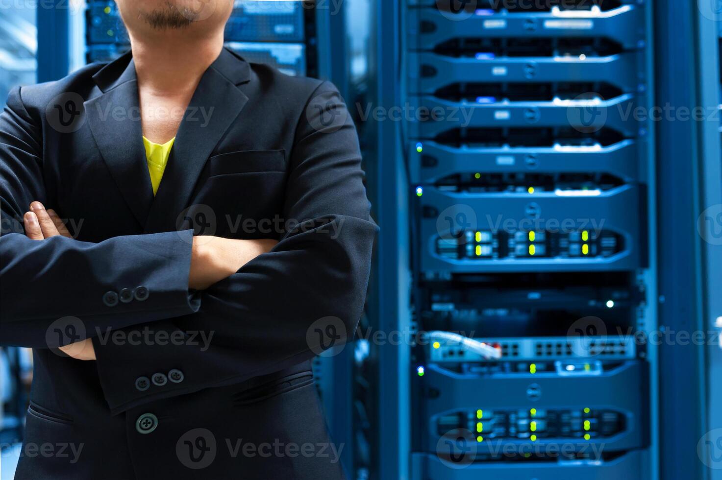 IT engineer repairing a server in a datacenter photo