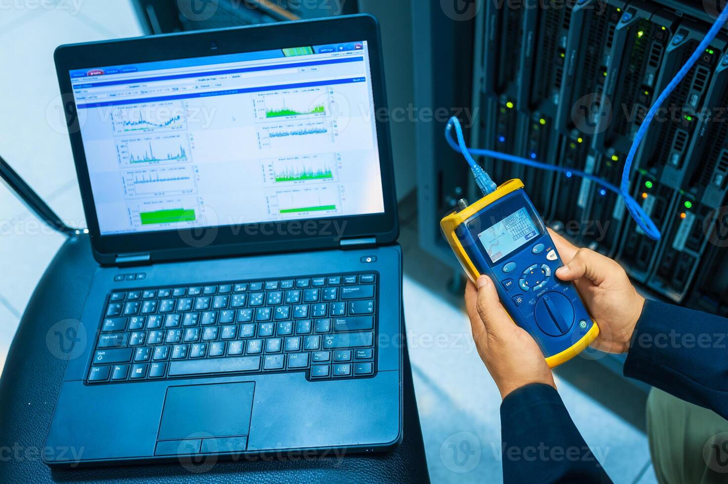 IT engineer repairing a server in a datacenter photo