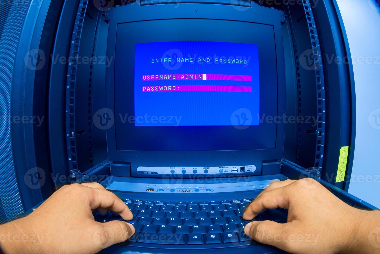 IT engineer repairing a server in a datacenter photo