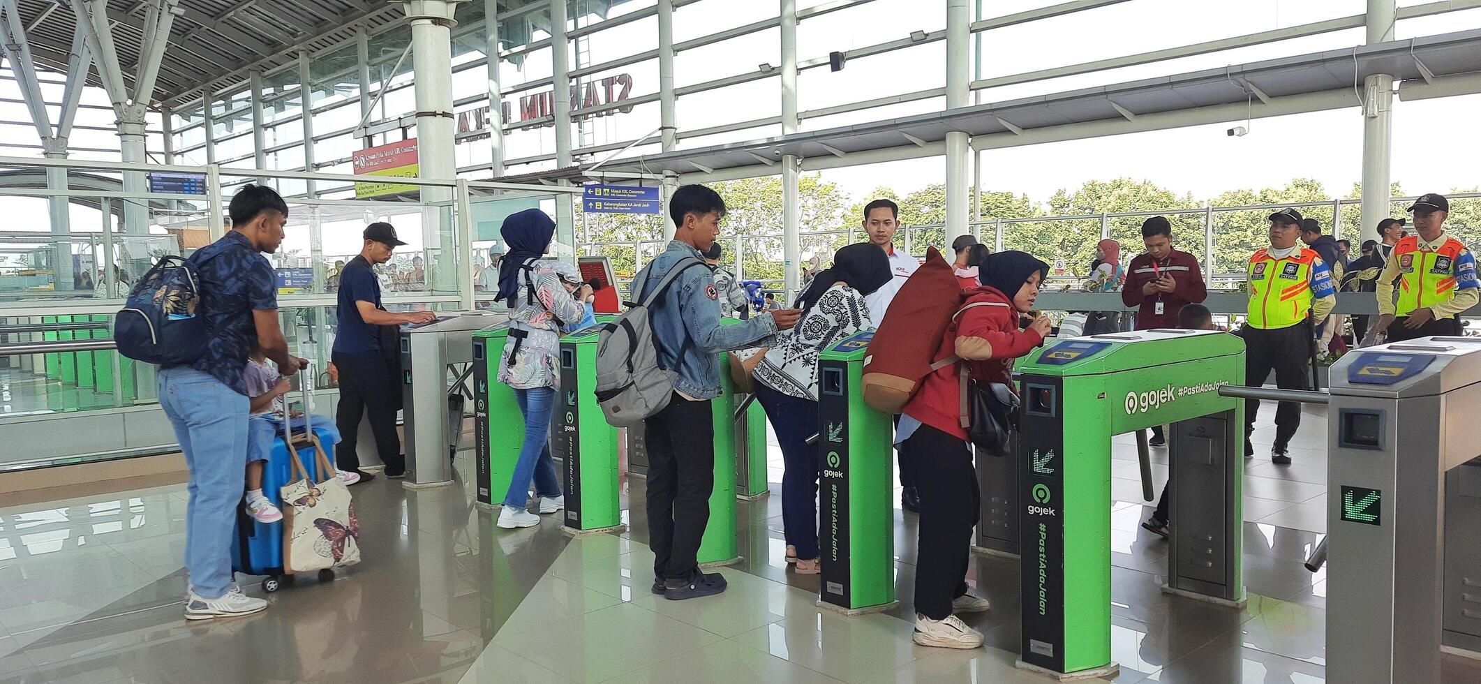 The atmosphere travelers or mudik lebaran or pulang kampung or idul fitri moments in train station Bekasi. West Java, Indonesia - April 8 2024 photo