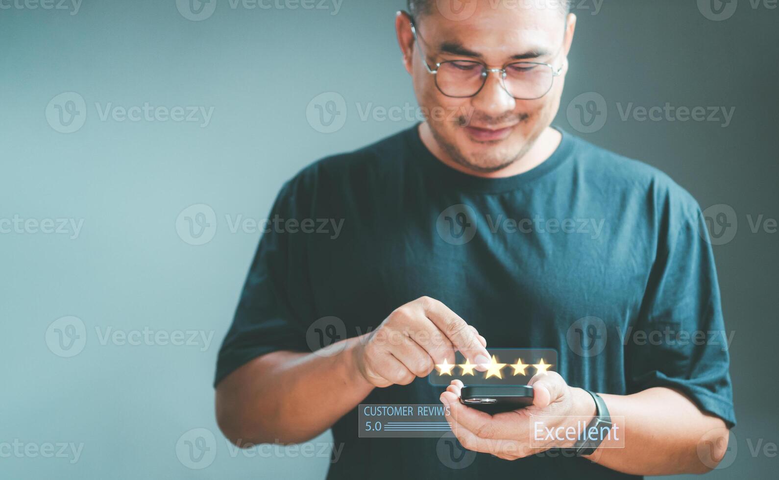 client review recommend excellent. Man hand using smartphone with popup five-star icon for rating review satisfaction service. Customer service experience, and business satisfaction After-sale service photo