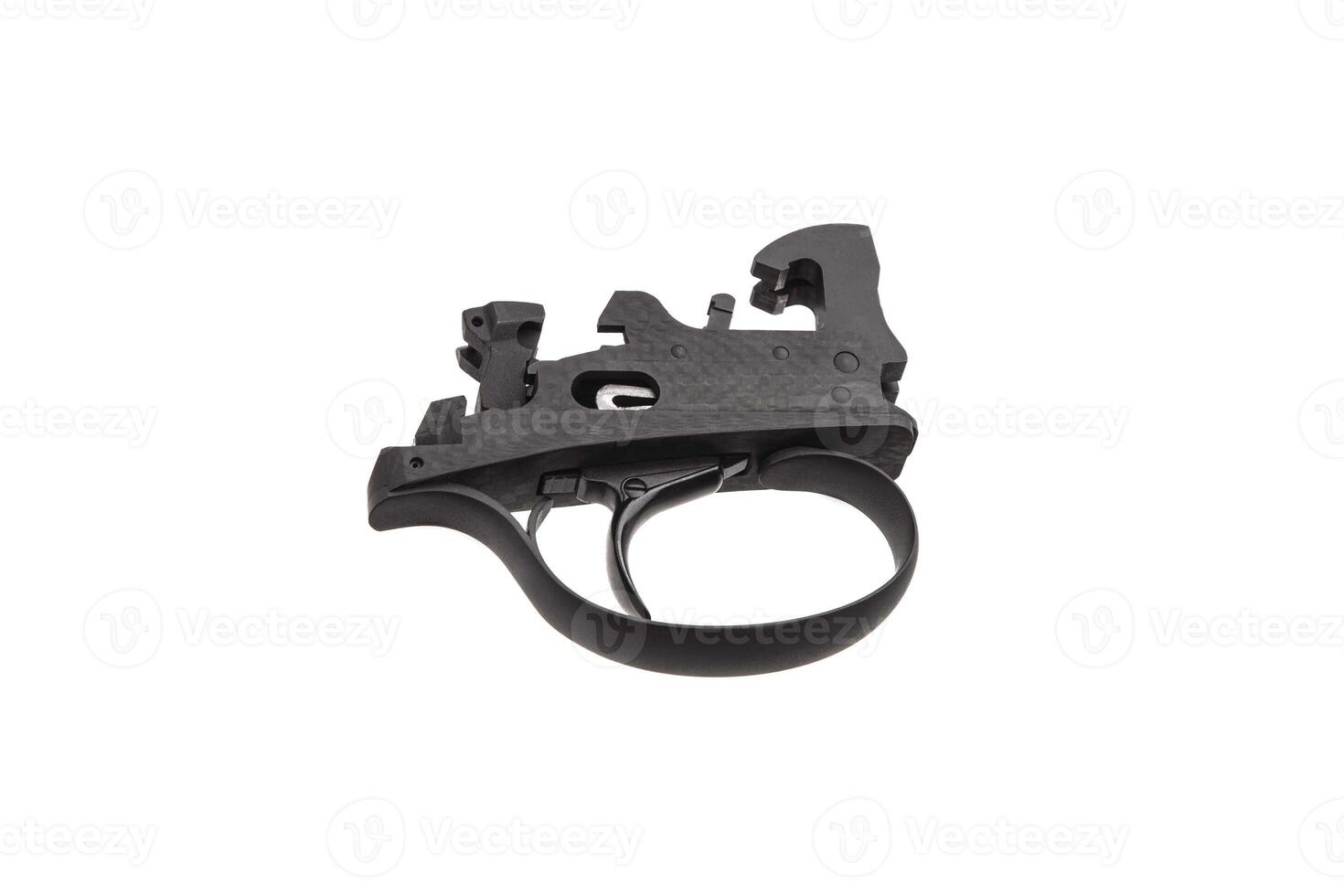 Shock trigger for shotgun isolate on white back. Gun trigger. Repair spare part. photo