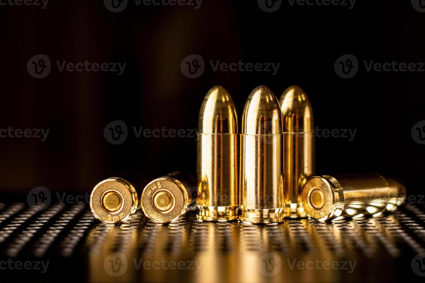 Pistol cartridges 9 mm. Ammunition for pistols and PCC carbines on a dark background. photo