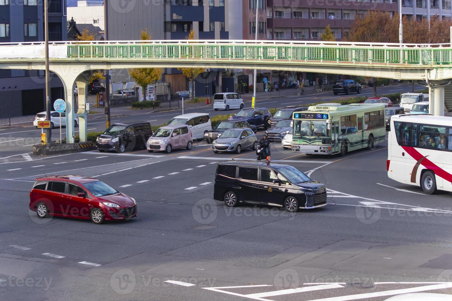 A traffic jam at the large crossing in Kyoto daytime photo