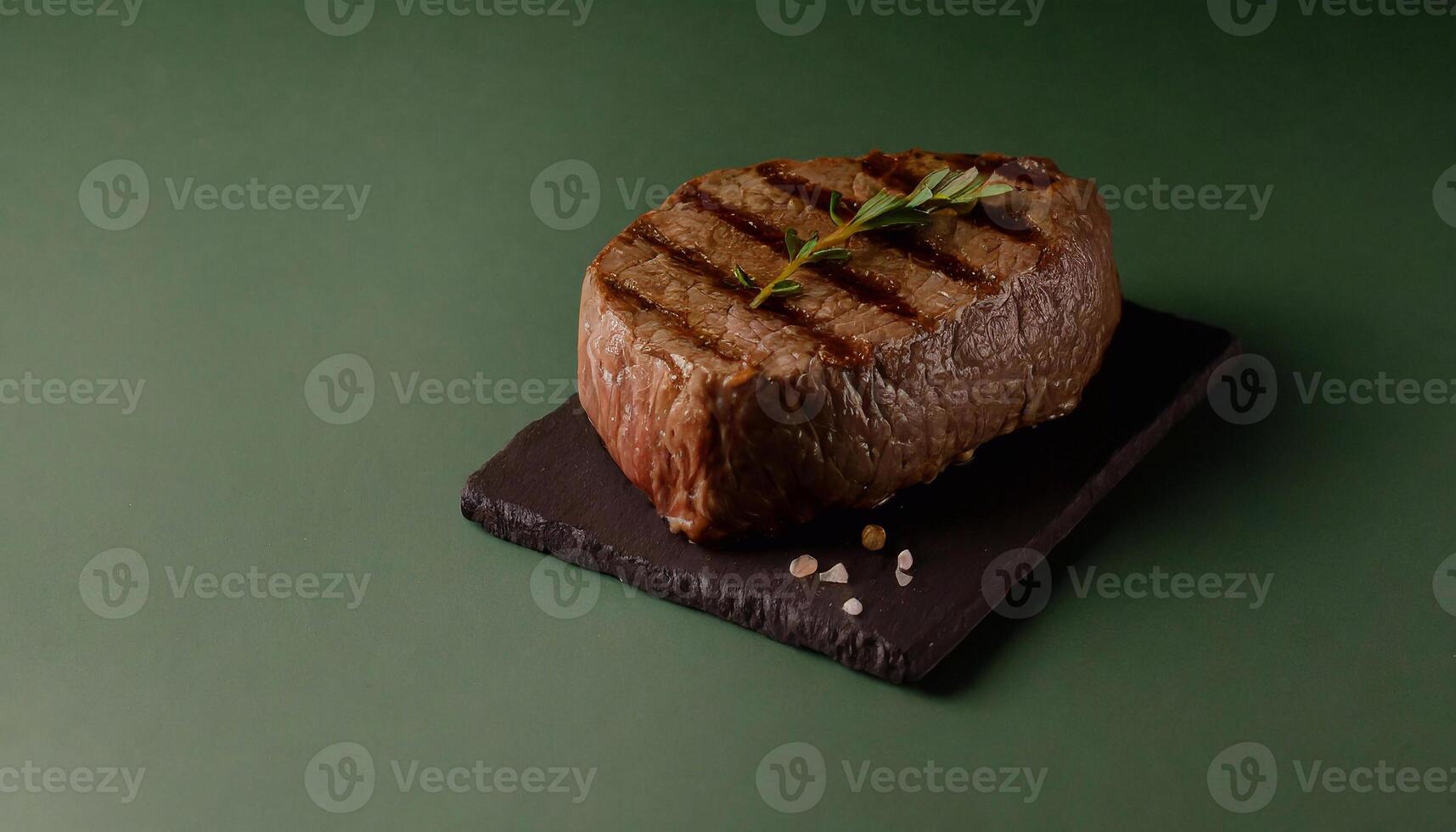 meat steak on the green background photo