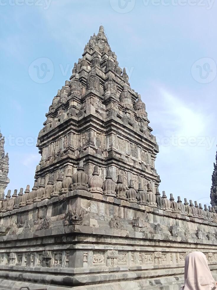 Prambanan temple with bright blue clouds photo