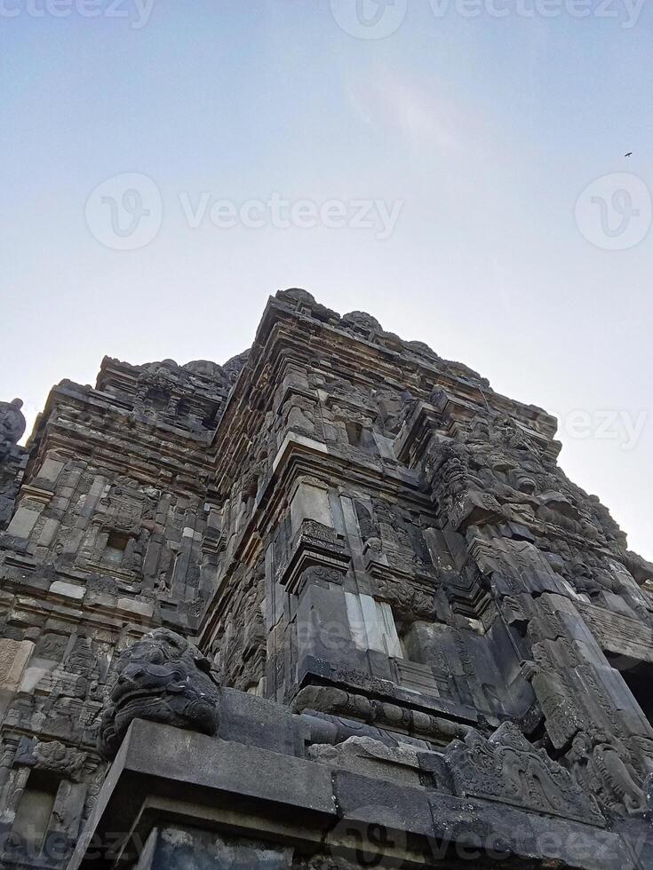 Prambanan temple with bright blue clouds photo