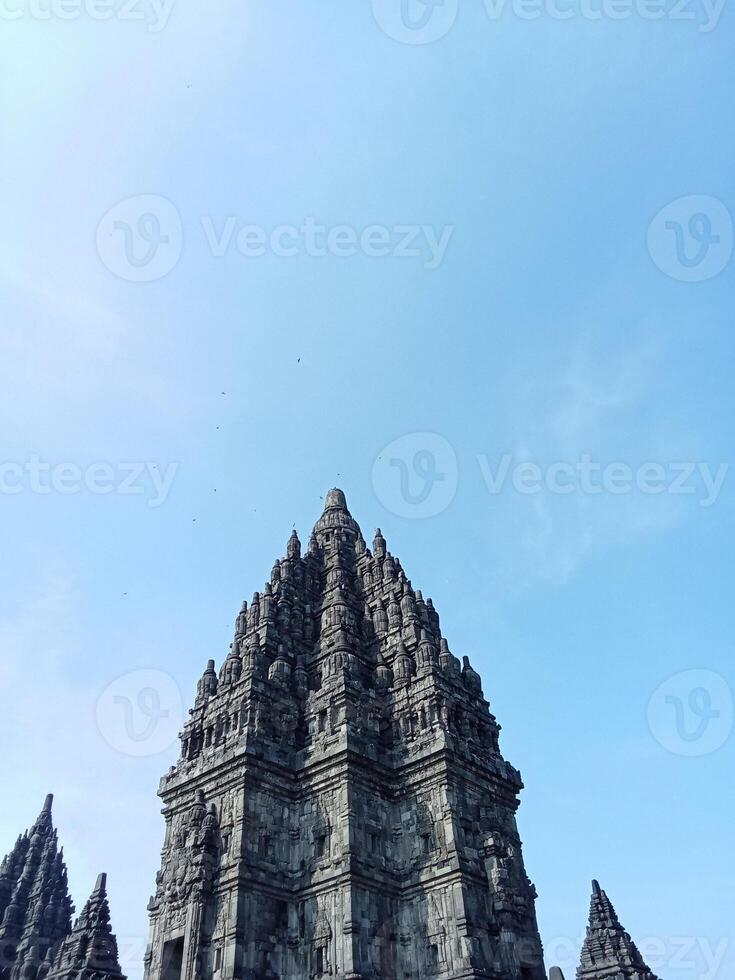 Prambanan temple with bright blue clouds photo