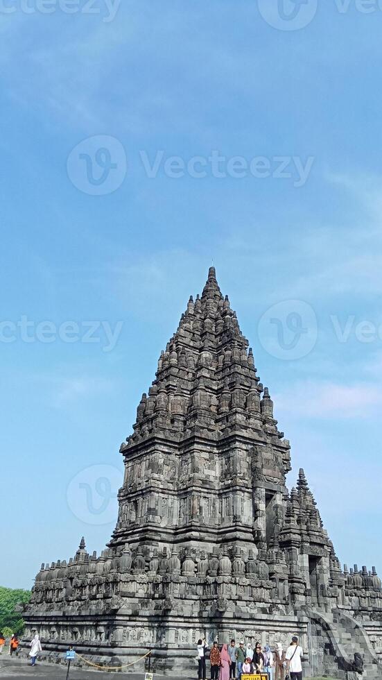 Prambanan temple with bright blue clouds photo