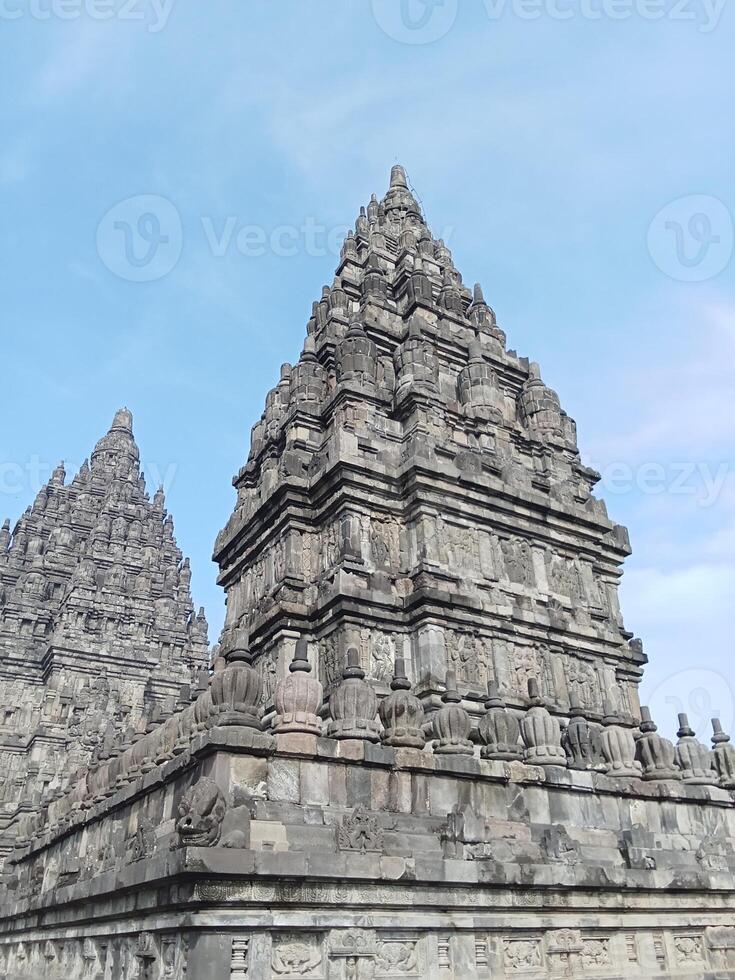 Prambanan temple with bright blue clouds photo