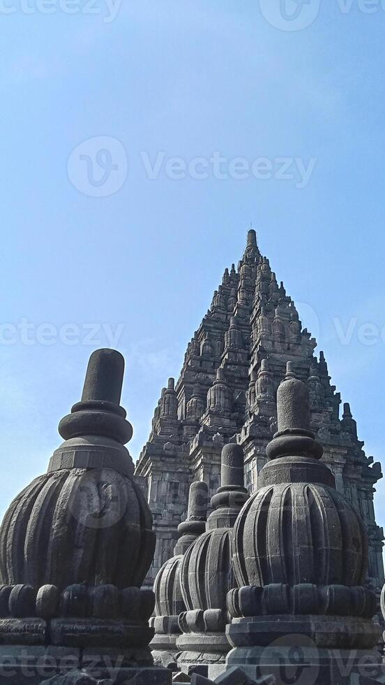 Prambanan temple with bright blue clouds photo