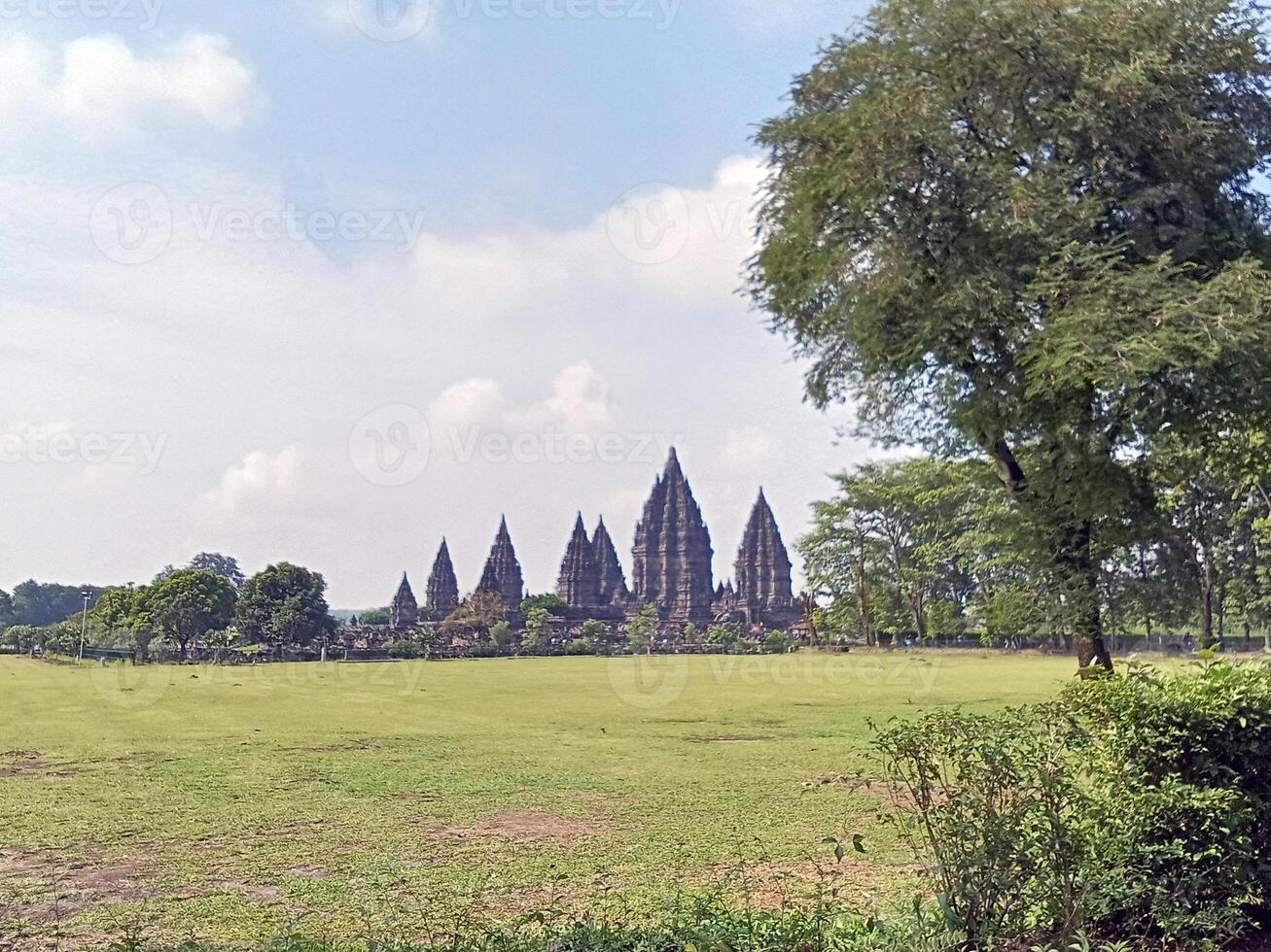 Prambanan temple courtyard with trees in Indonesia photo