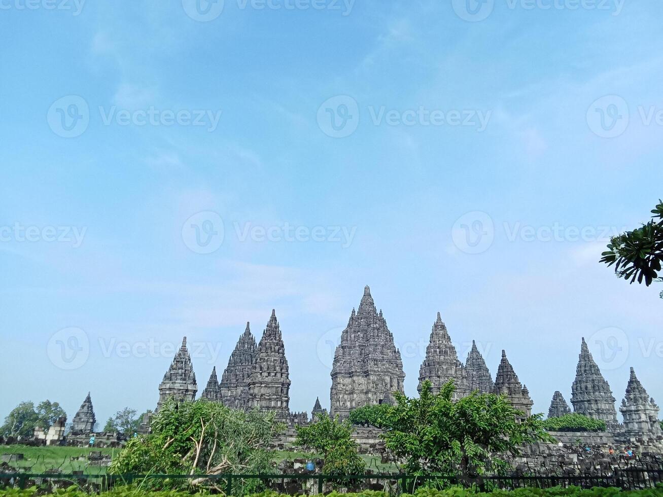 Prambanan temple with bright blue clouds photo