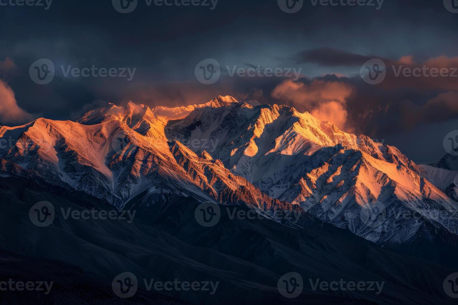 Majestic Snow-Covered Mountain Under Cloudy Sky photo