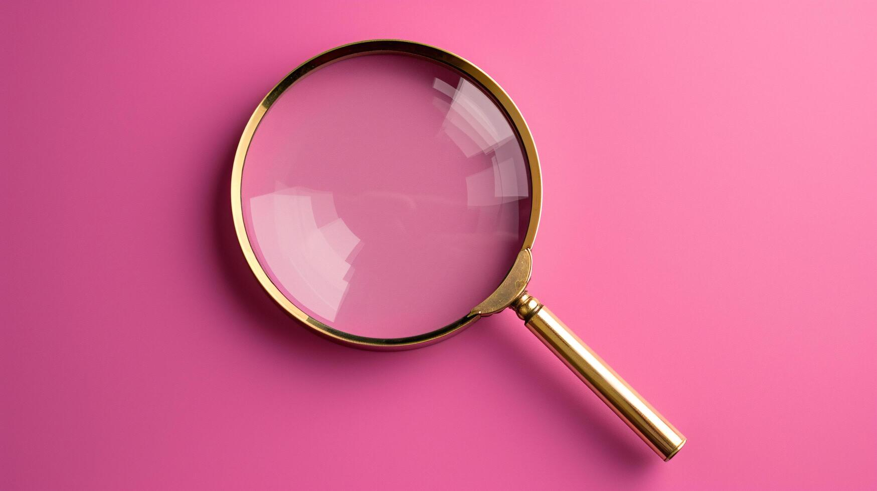 A single antique magnifying glass, placed against a muted colored background, symbolizes curiosity and discovery photo