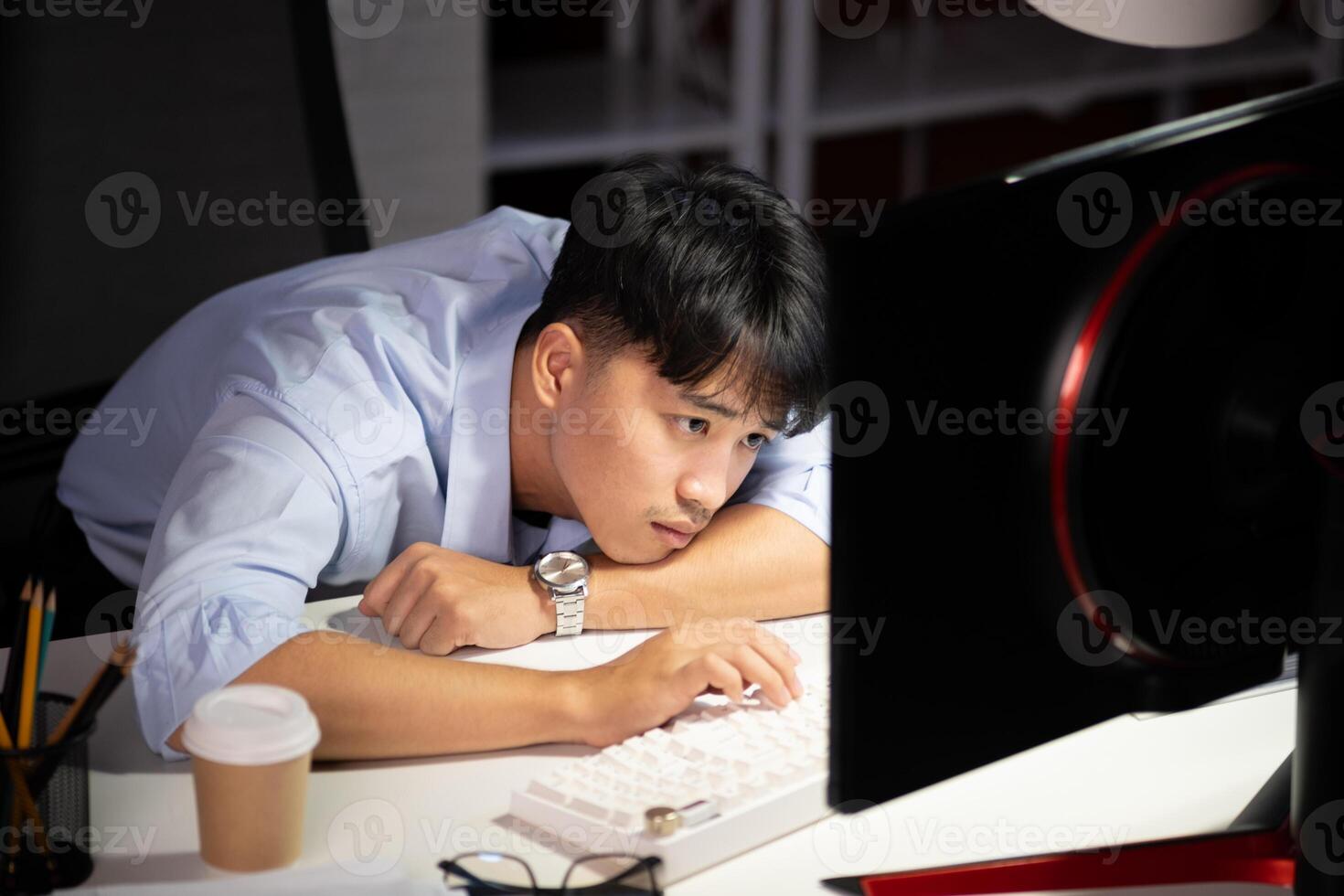 Businessman working overtime at his office He felt tired. photo