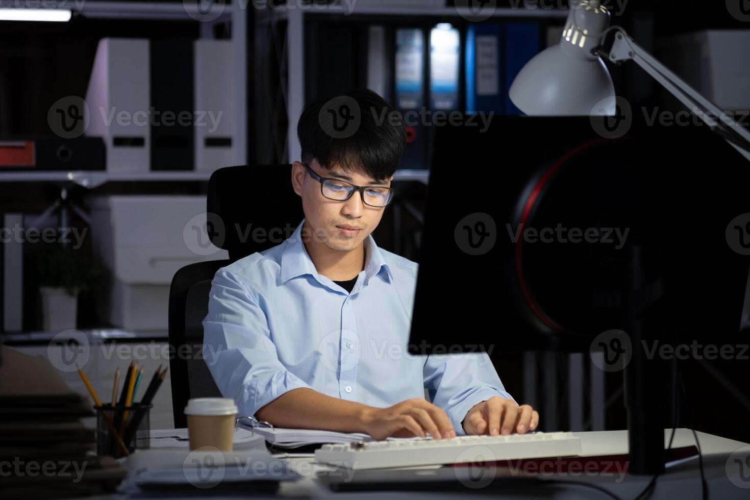 Businessman working overtime at his office He felt tired. photo