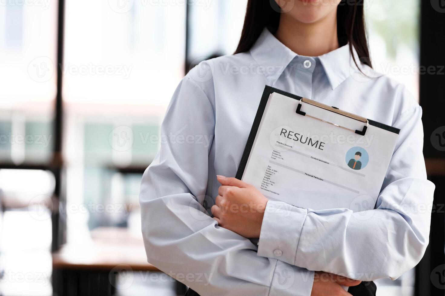 Close-Up of Businessman Holding a Resume. photo