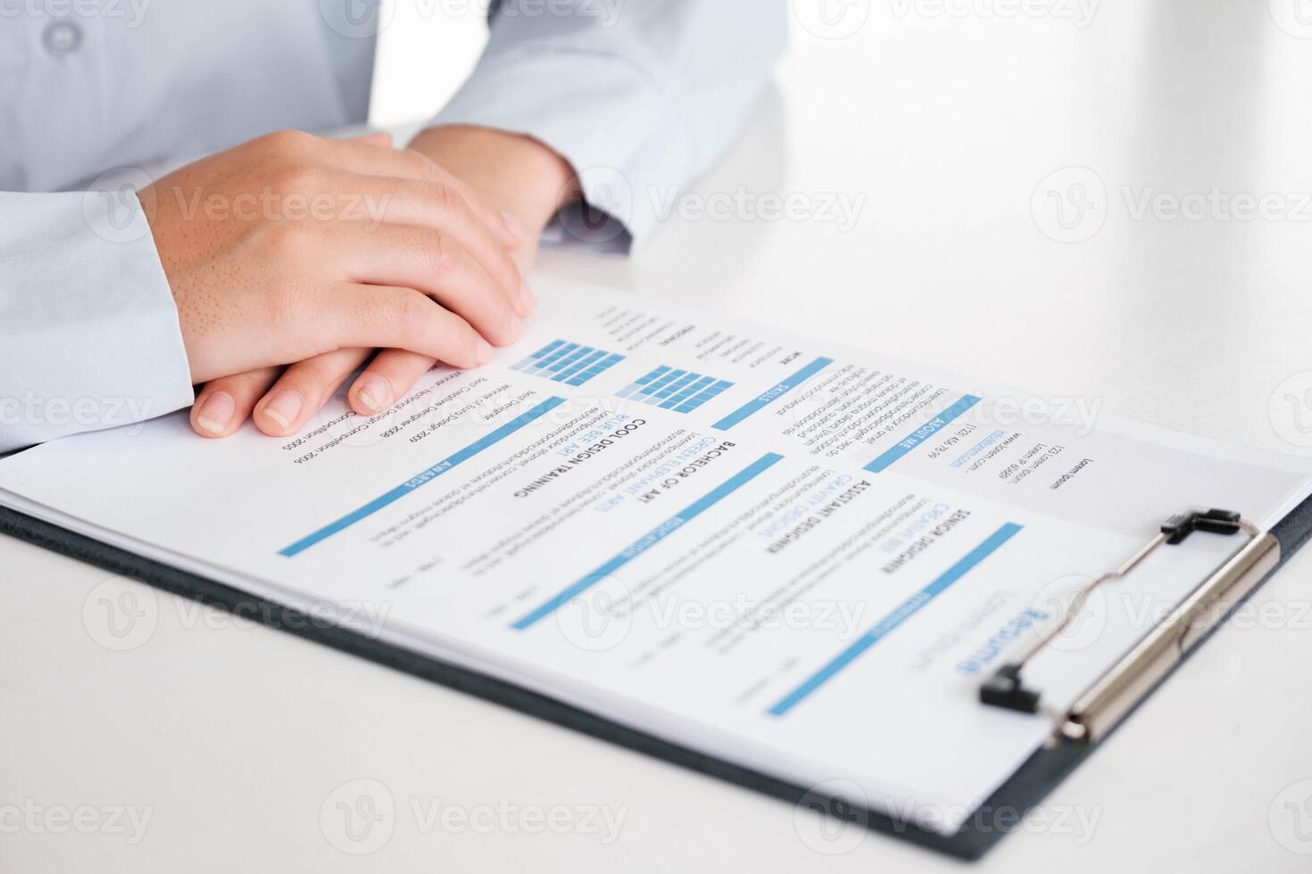 Close-Up of Businessman Holding a Resume. photo