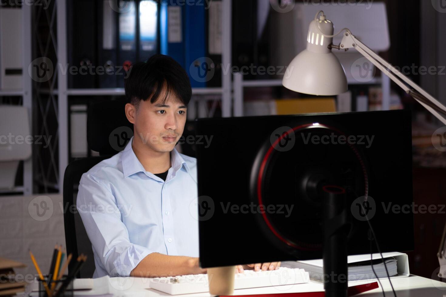 Businessman working overtime at his office He felt tired. photo