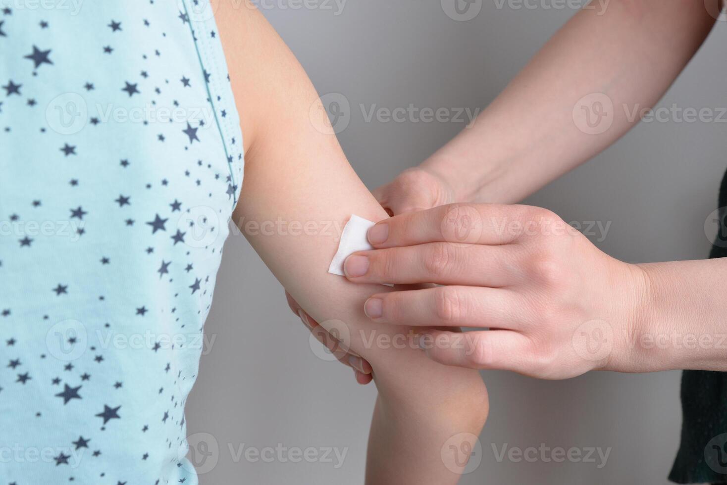 Hand disinfection with alcohol wipe. Preparation for vaccine, insulin injection, or sensor placement. Medical, healthcare, or hygiene concept photo