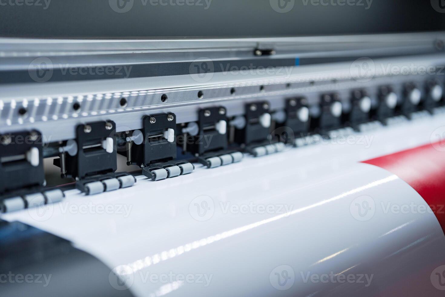 Close-up of large format printer heads in action photo