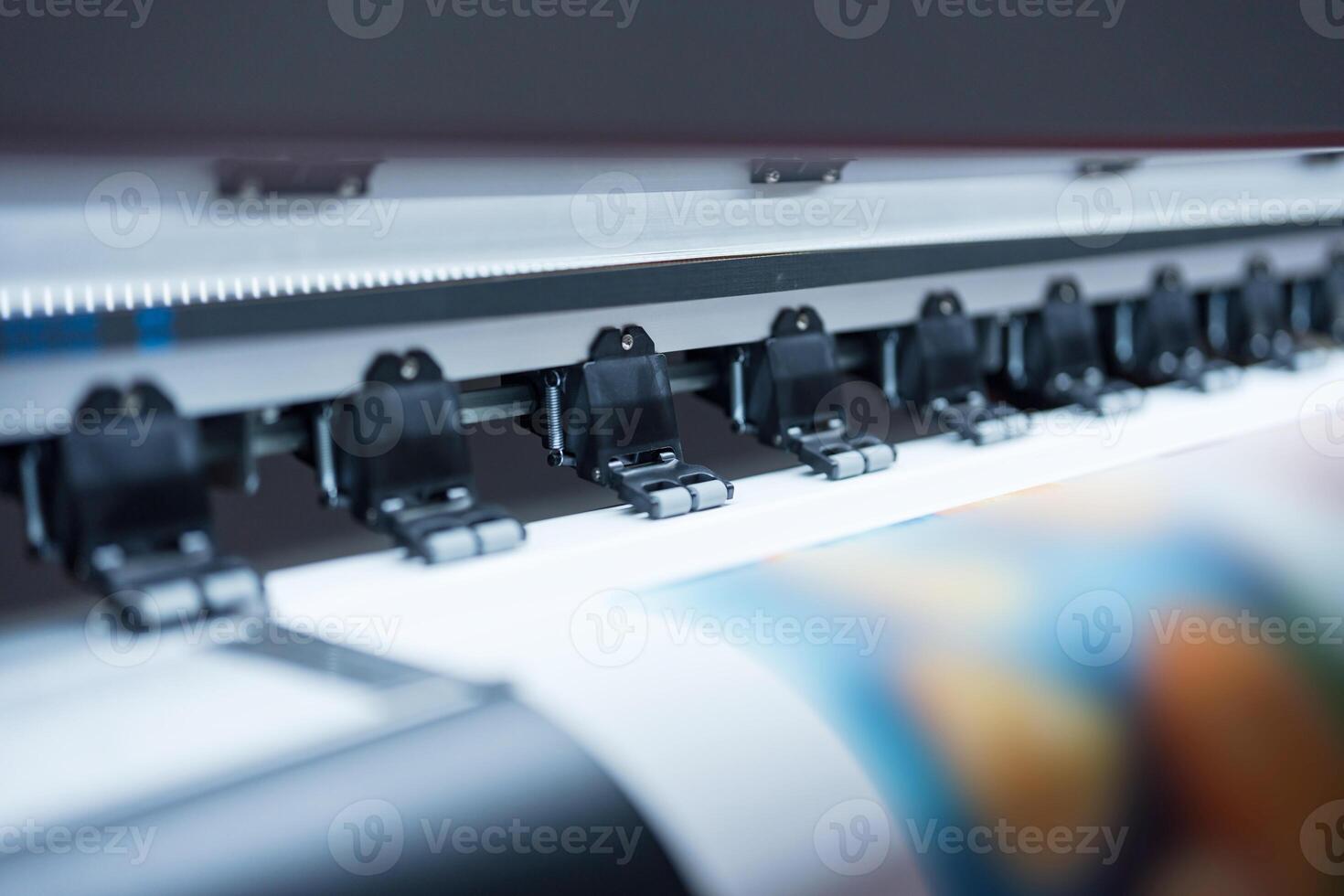 Close-up of large format printer heads in action photo