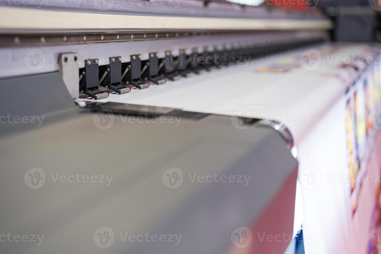 Close-up of large format printer heads in action photo