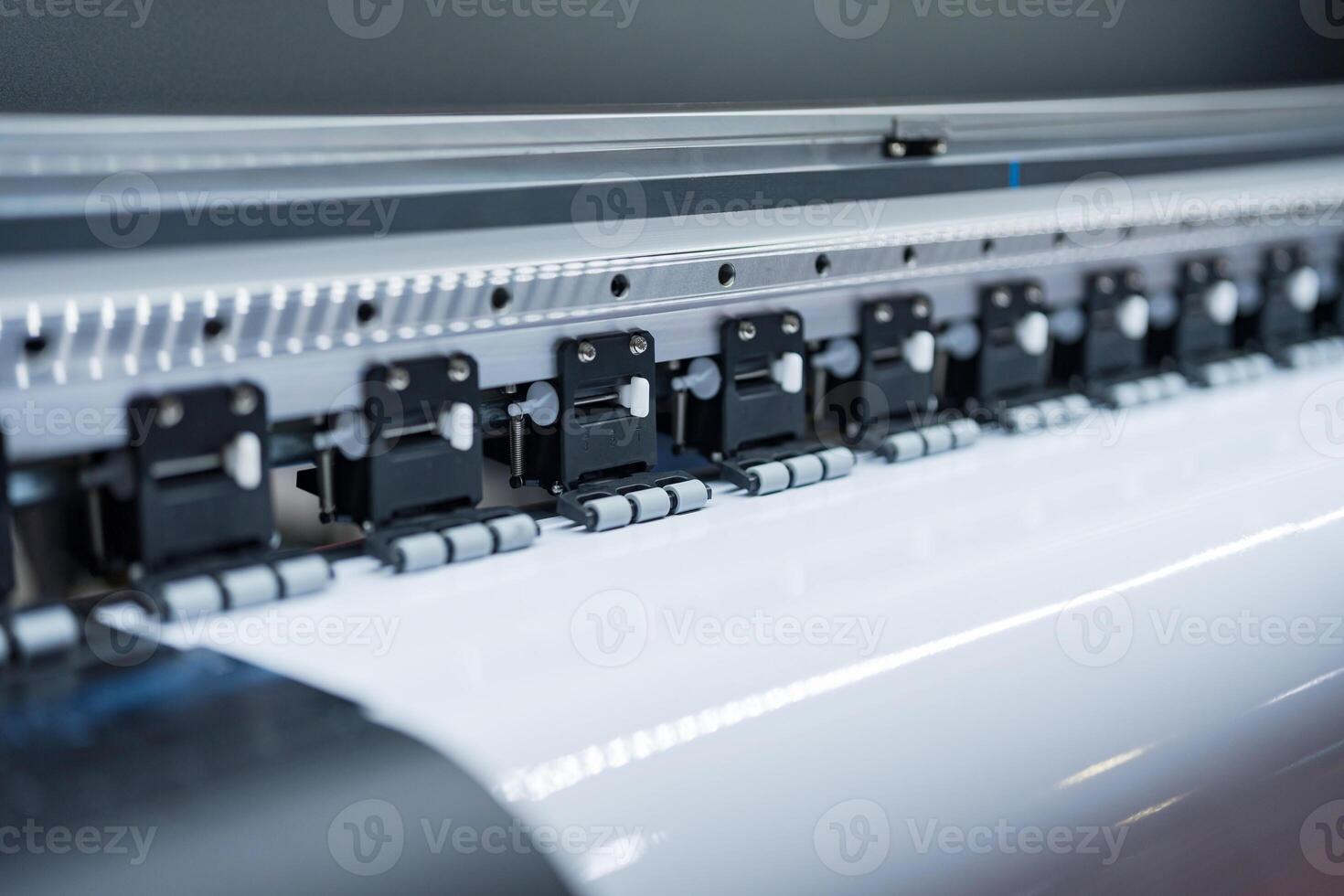 Close-up of large format printer heads in action photo