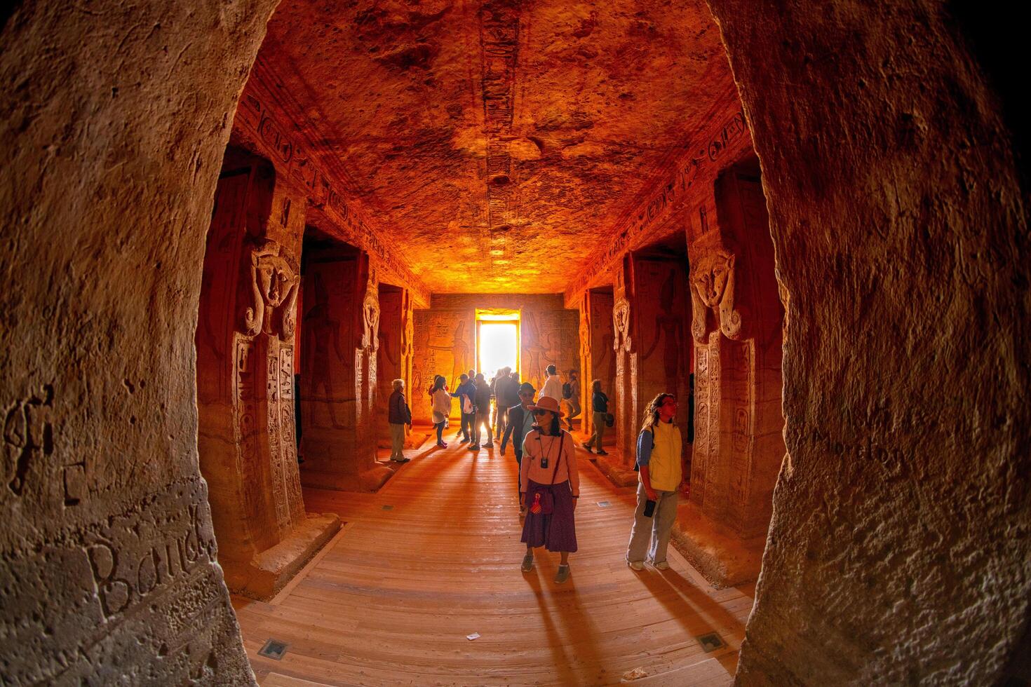 Aswan, Egypt - December 23, 2022 - Tourists visit to Abu Simbel temples, inside the Small Temple of Hathor and Nefertari photo