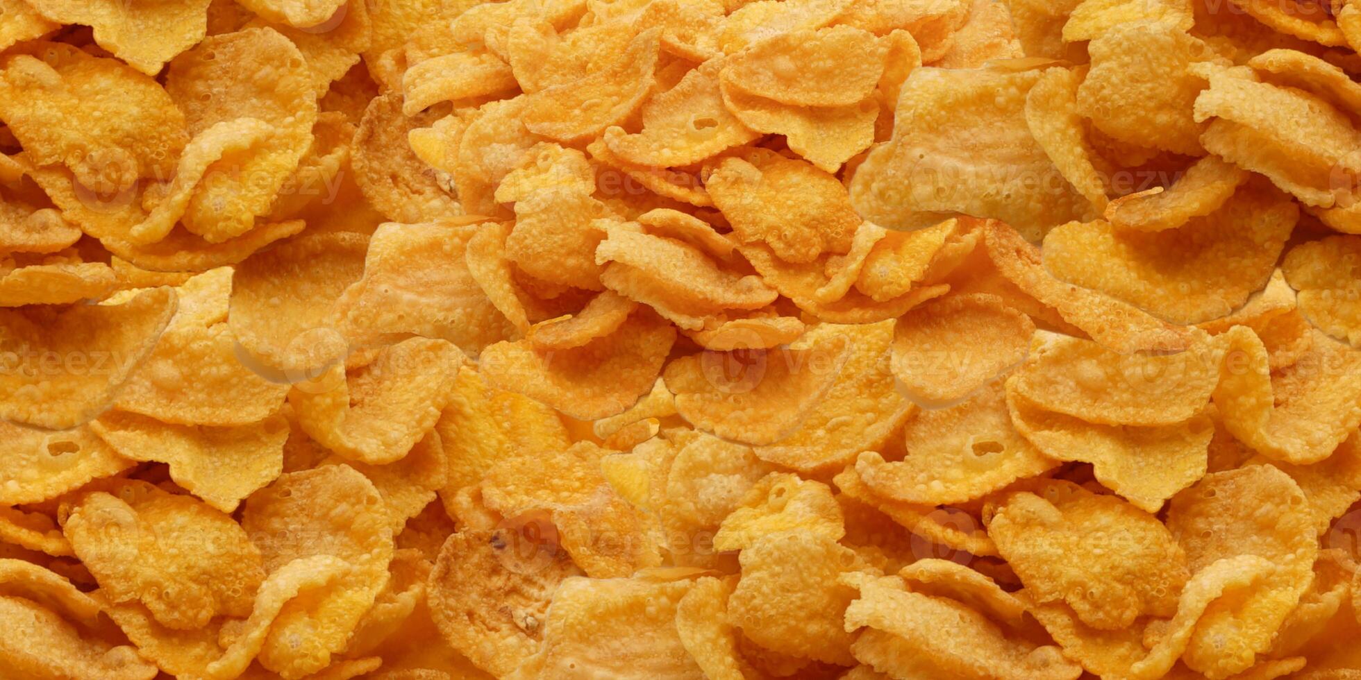 Cornflakes theme. Breakfast cereals background. photo