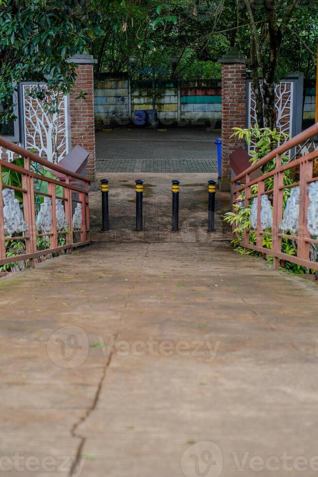 narrow path from the bridge to the pedestrian parking area. photo