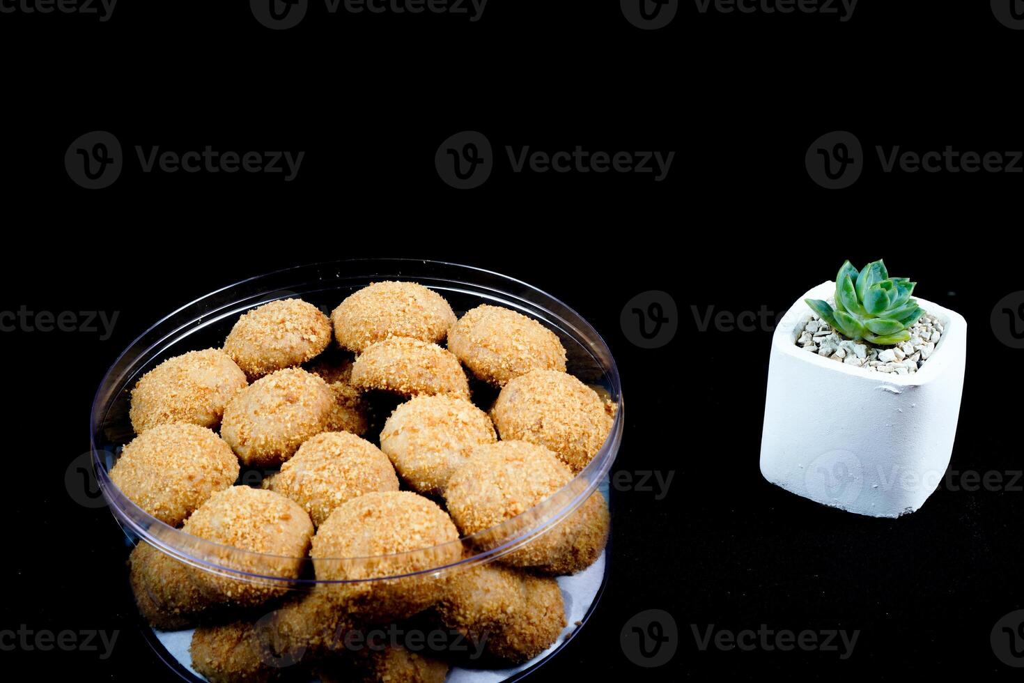 close up view of a beautiful chestnut cake on a black background. photo