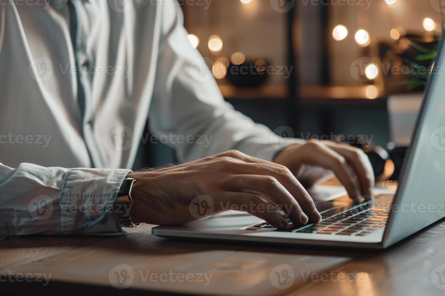 Corporate businessman in suit working on laptop in his office photo