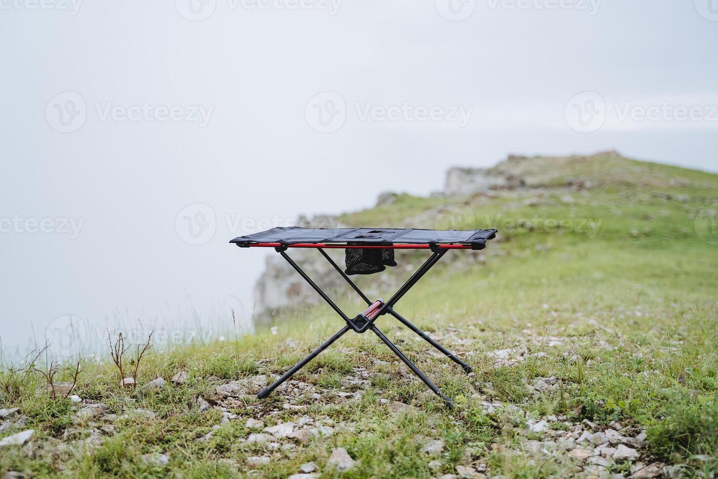 Small size frame table for camping, furniture made of light materials, trekking in the mountains, table for eating, tourist equipment photo