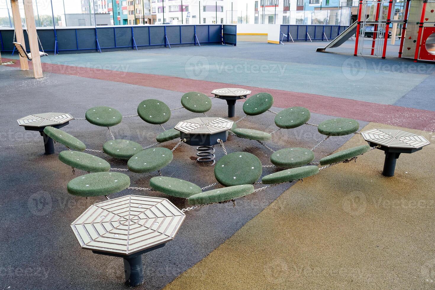 Obstacle course on the playground in the courtyard of the house, round areas for the passage of players. outdoor games. photo