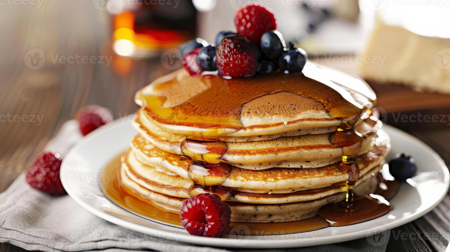 delightful breakfast scene with stack of pancakes with syrup and fresh raspberries, blueberries, served on white plate. Tempting breakfast dessert option, culinary delights, brunch menus photo