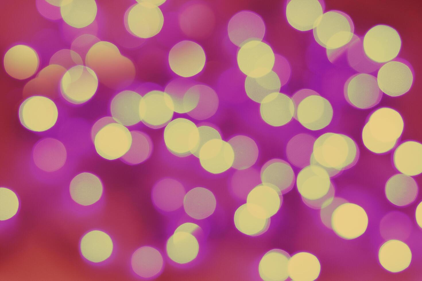 Blurred bokeh magical background. Red and yellow gradient. Shimmer confetti pattern. Abstract christmas and new year holidays effect. Festive blue luminous background. photo