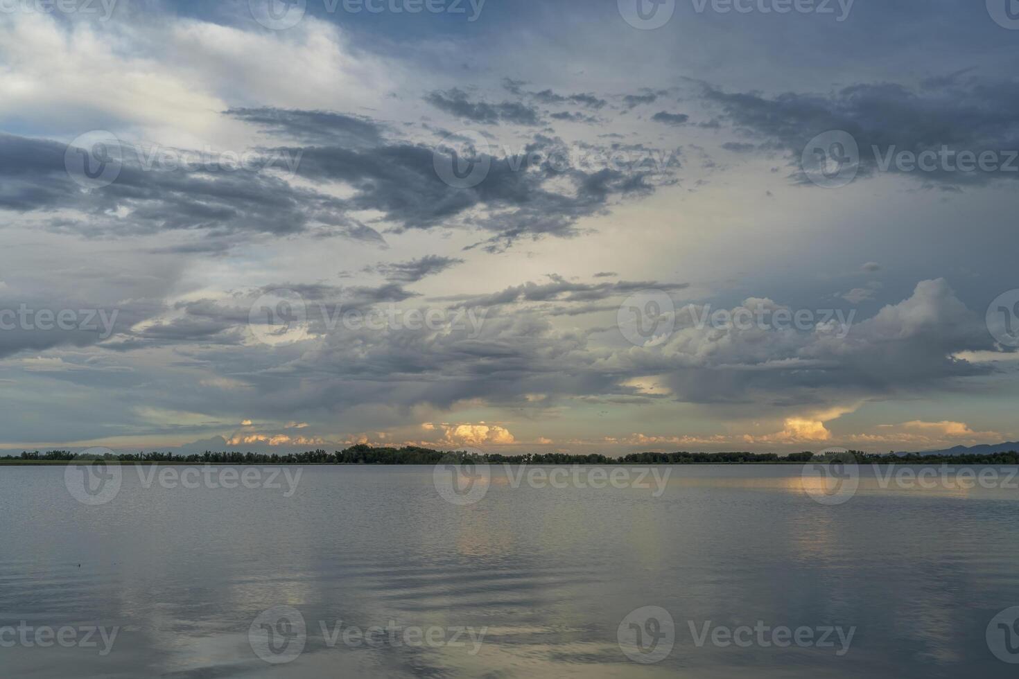 stormy evening sky over lake photo