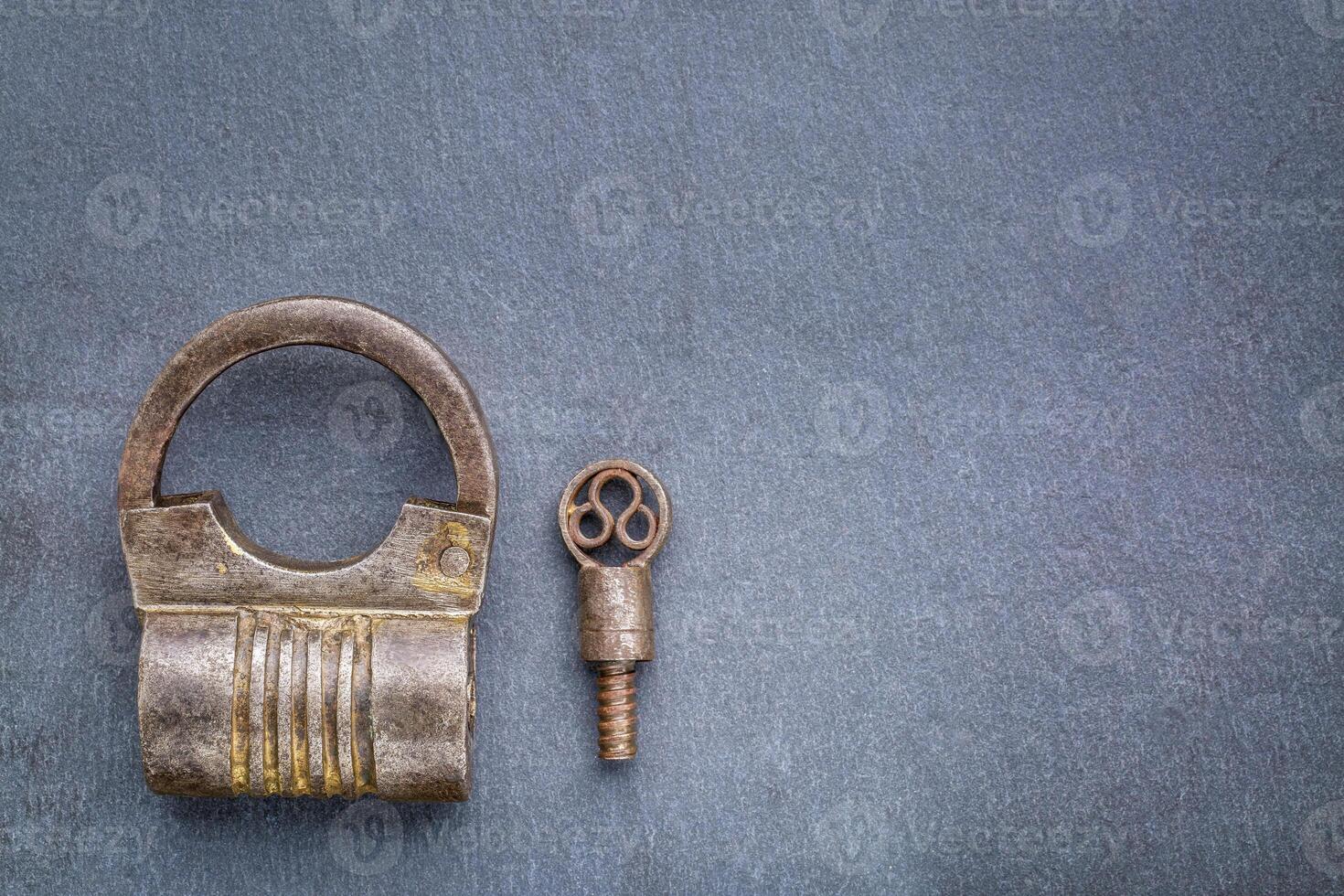 vintage screw type iron padlock photo