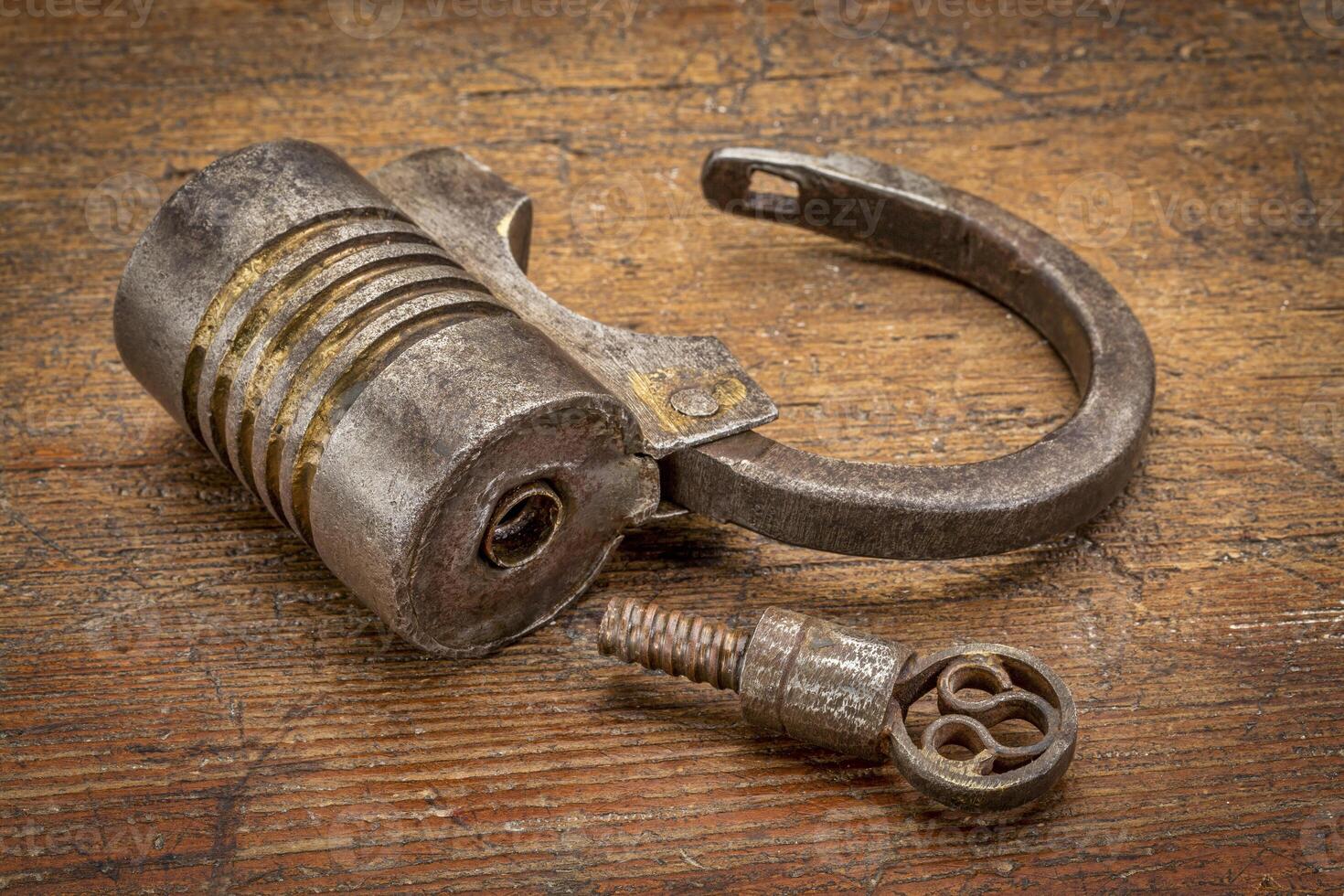 vintage screw type iron padlock photo