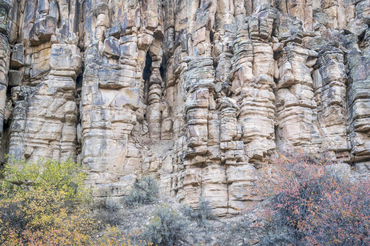 sandstone cliff with columns and pillars photo