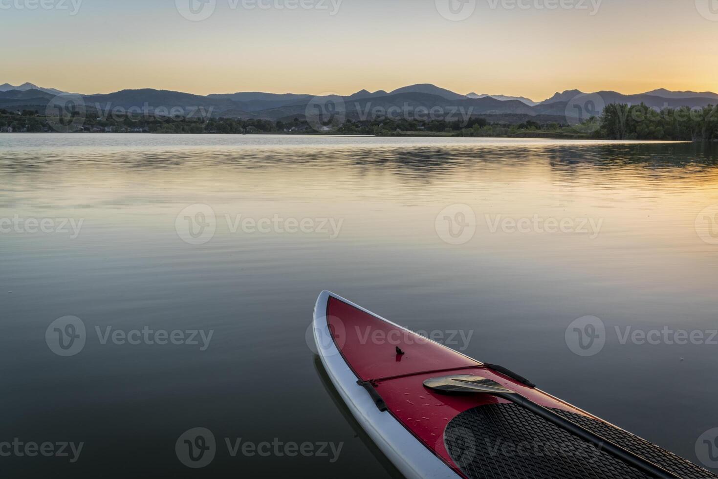 stand up paddleboard on lake photo